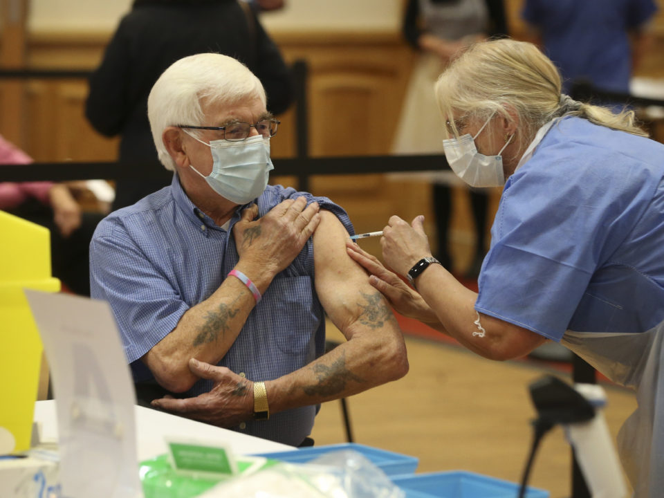 John Waplington, 82, of Arnold receives a Covid-19 vaccination