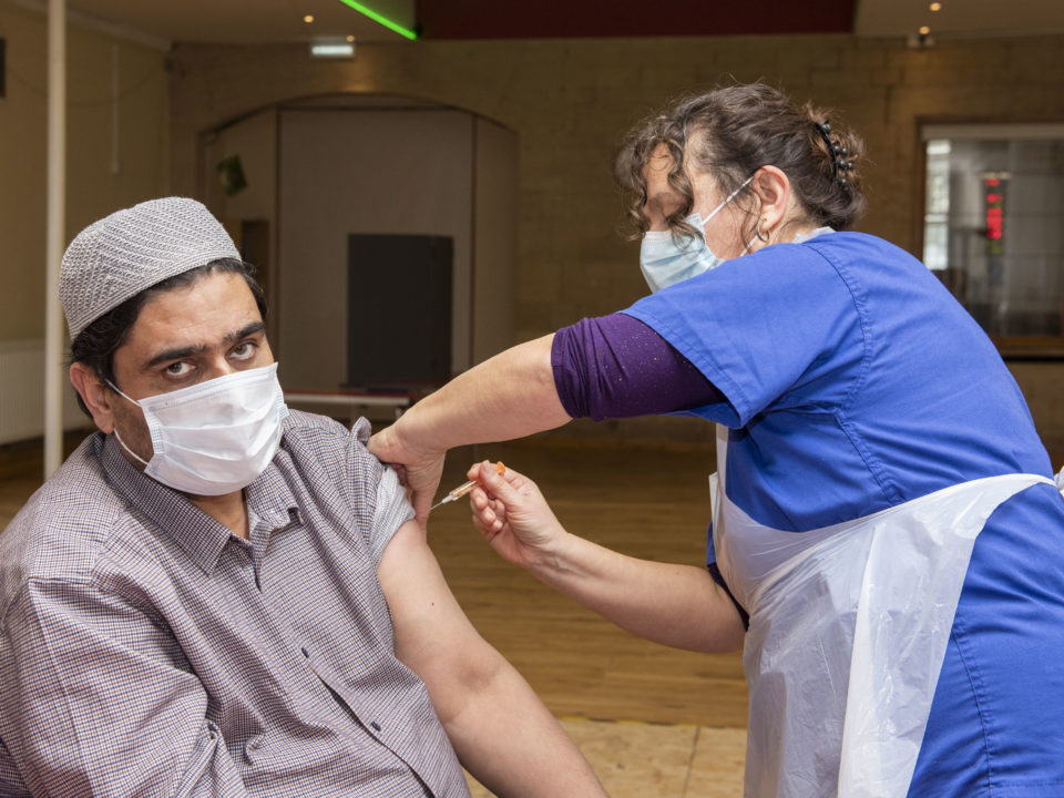 Mr Gul receives his Covid-19 vaccina